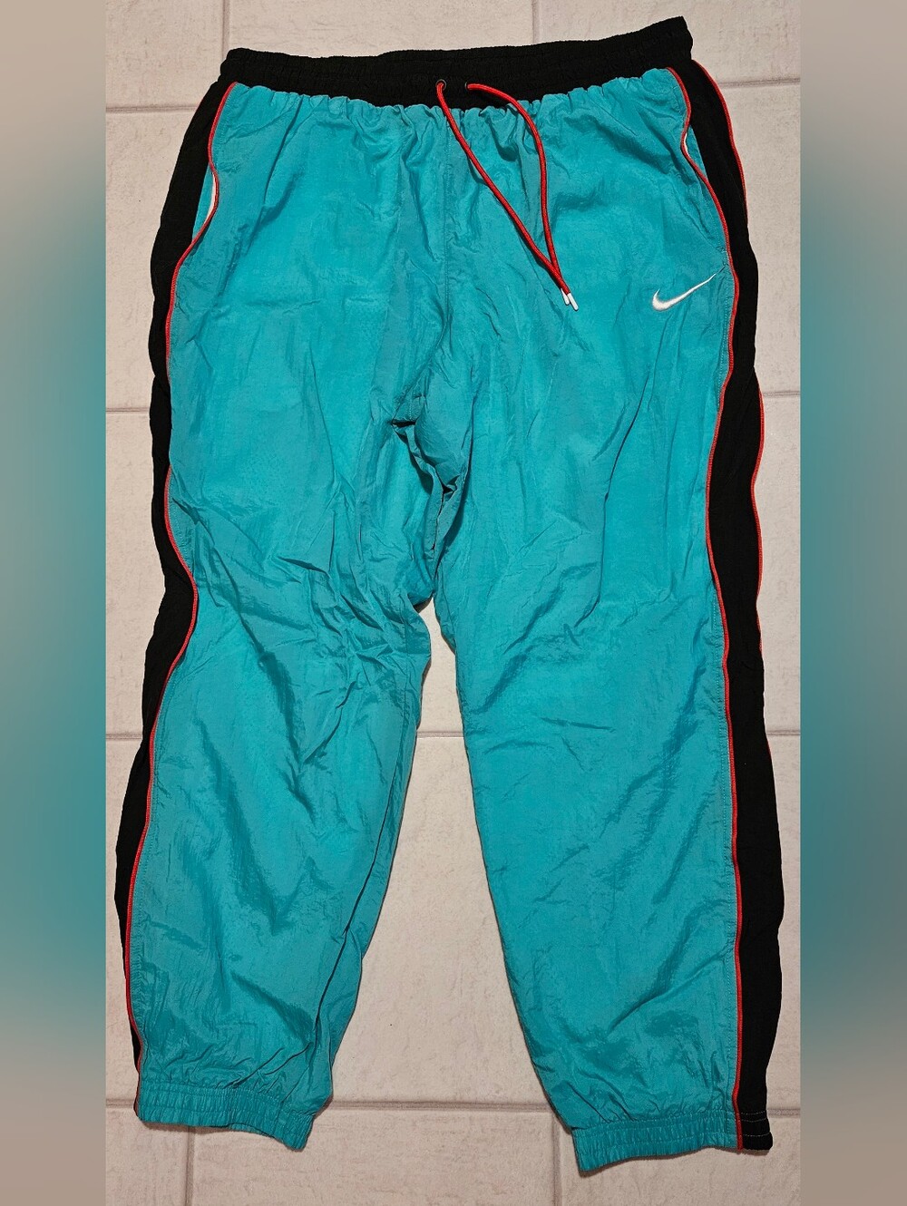 Nike Turquoise Sweatpants with Black Side Panels and Red Trim
